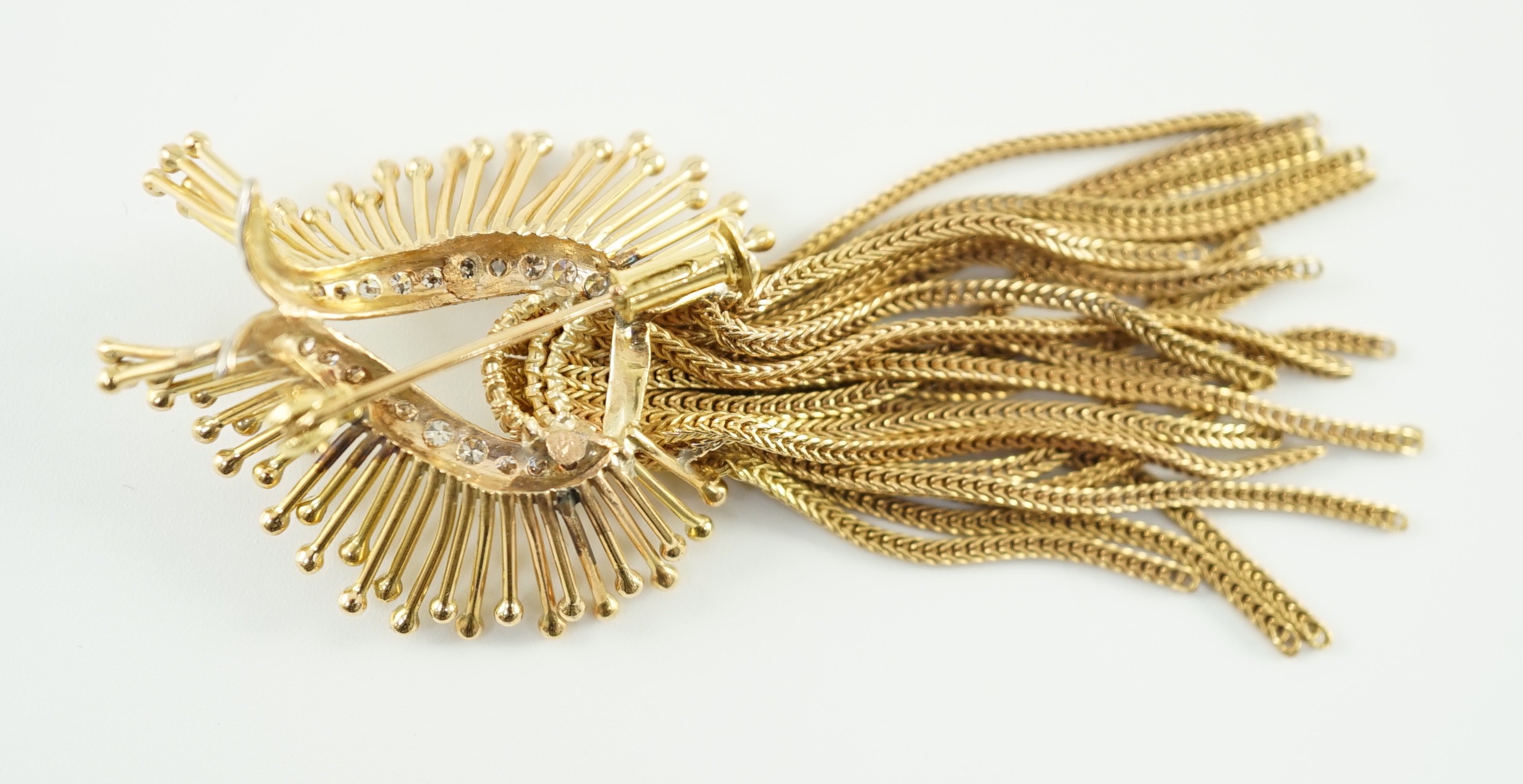 A late 20th century stylish continental gold and diamond cluster set tassel brooch